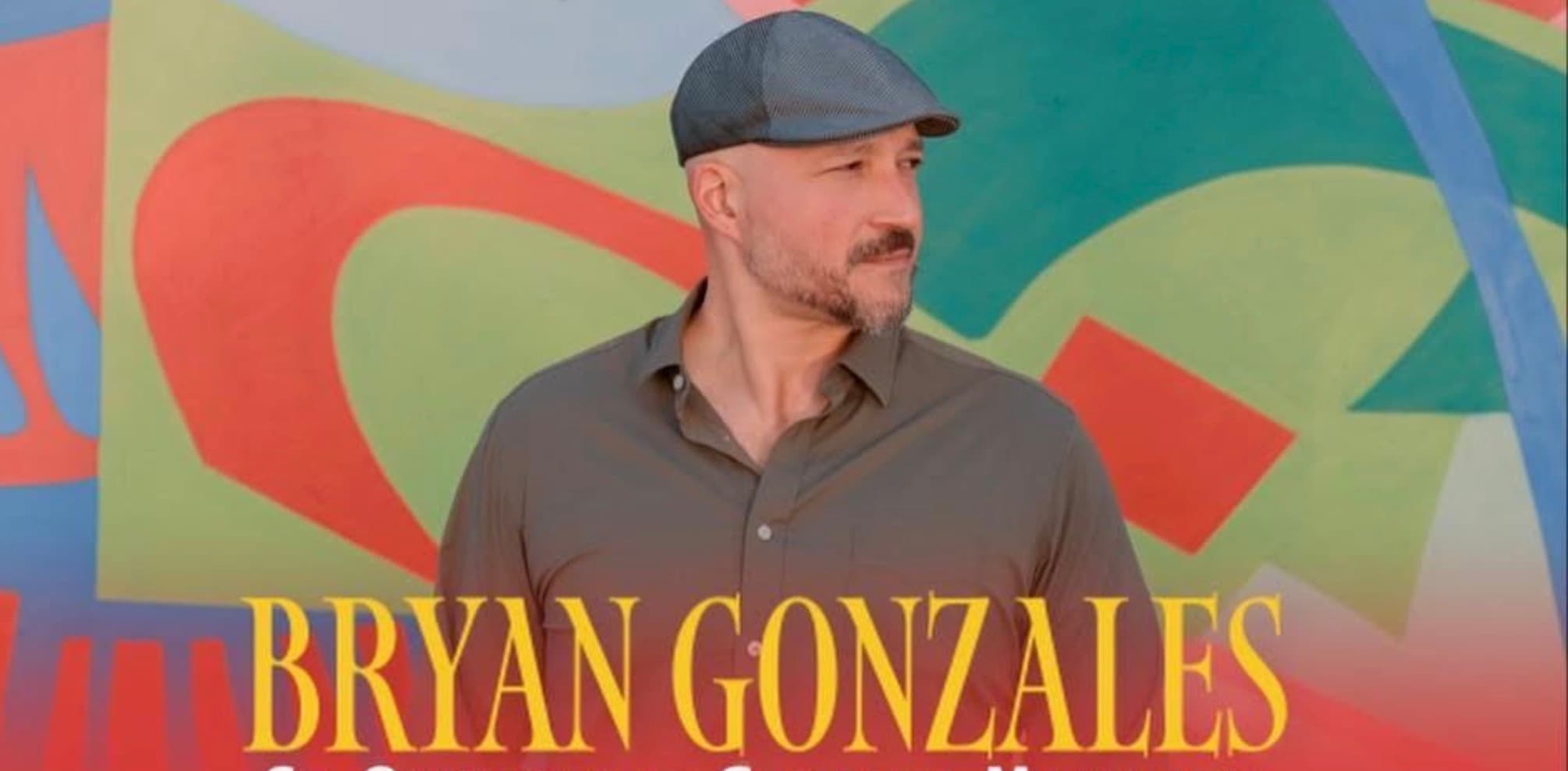 Bryan Gonzales in a flat cap and olive shirt before a vibrant abstract mural.